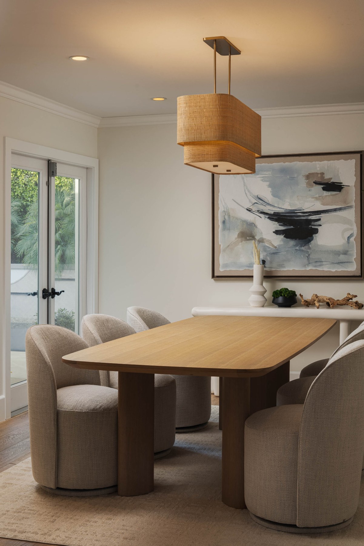 Dining area at 433 Seaward Road with an oval wood table, upholstered chairs and a pendant light